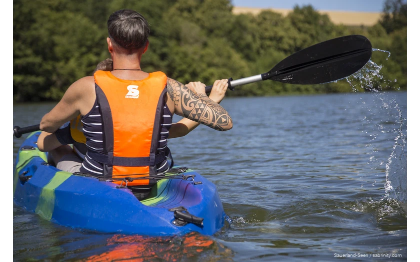 Man and a child canoeing