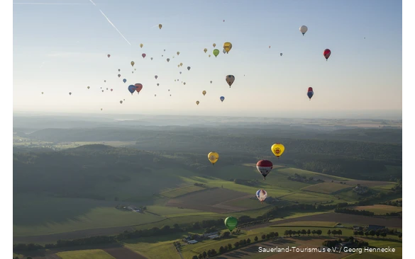 Many hot air balloons fly over the Sauerland