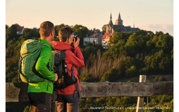A woman takes a photo above Marsberg.