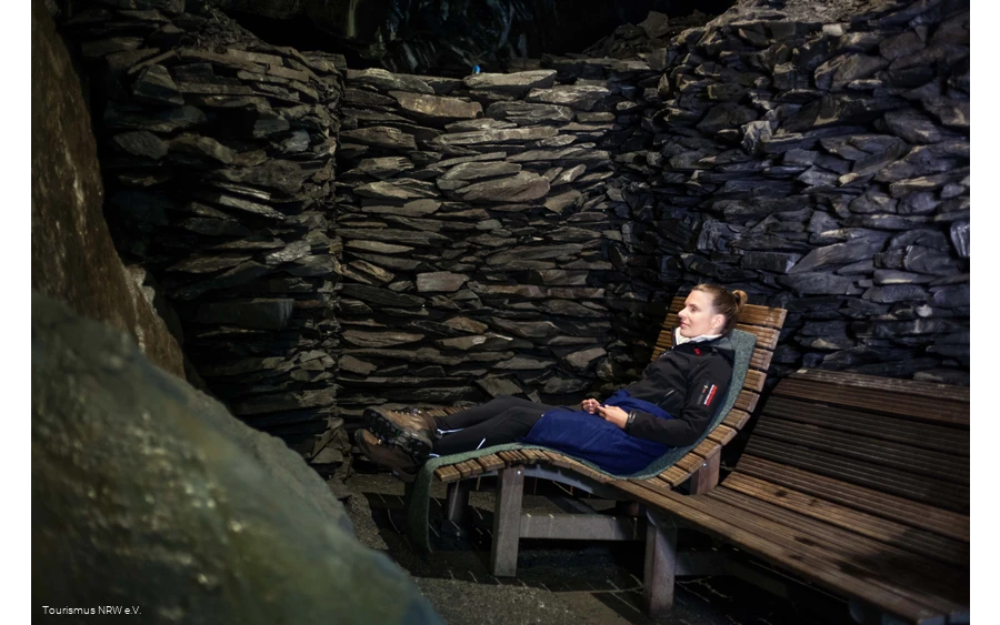 A woman sits in the cave in Nordenau