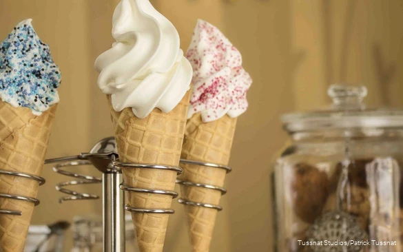 Three ice cream cones in a stand.
