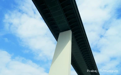 View of a highway bridge from below.