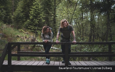 Couple taking a break on a bridge