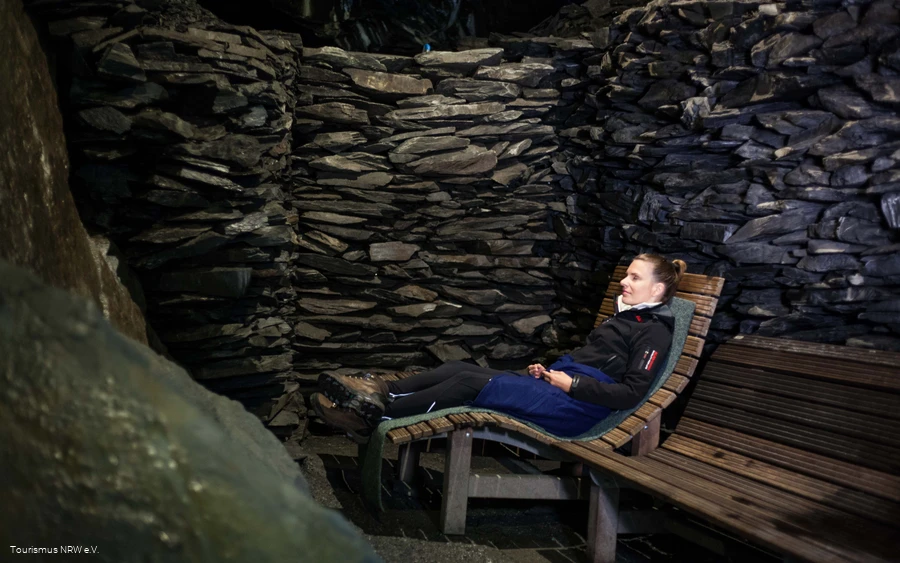 A woman sits in the cave in Nordenau