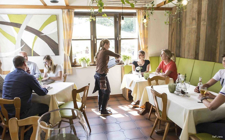 Guests in Steinberg's restaurant are served.