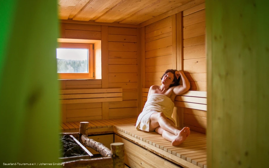 A woman relaxes in the sauna.