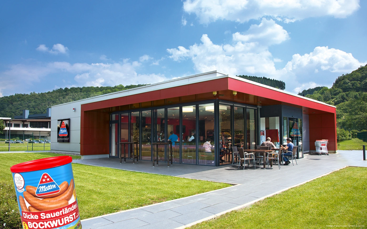 Exterior shot of the Metten factory outlet with a can of Dicken Sauerland Bockwurst in the foreground