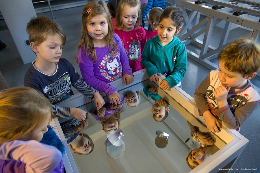 Children experimenting at a table.